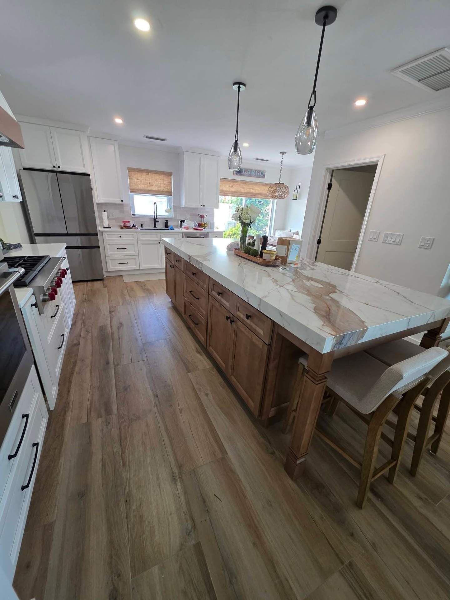 Custom kitchen with marble waterfall island